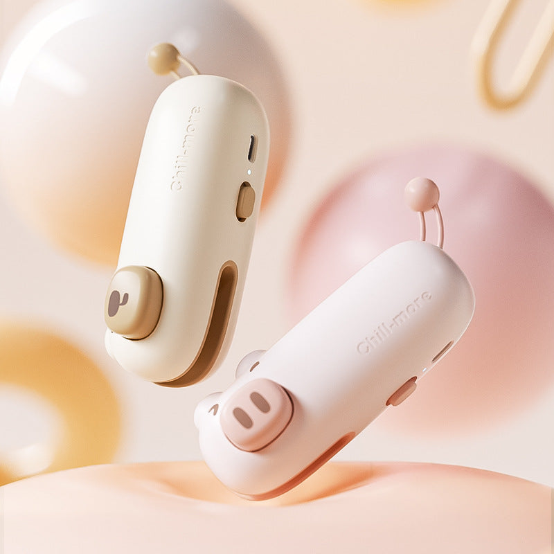 Coffee Bear and Pink Pig bag sealers showing charging ports and controls