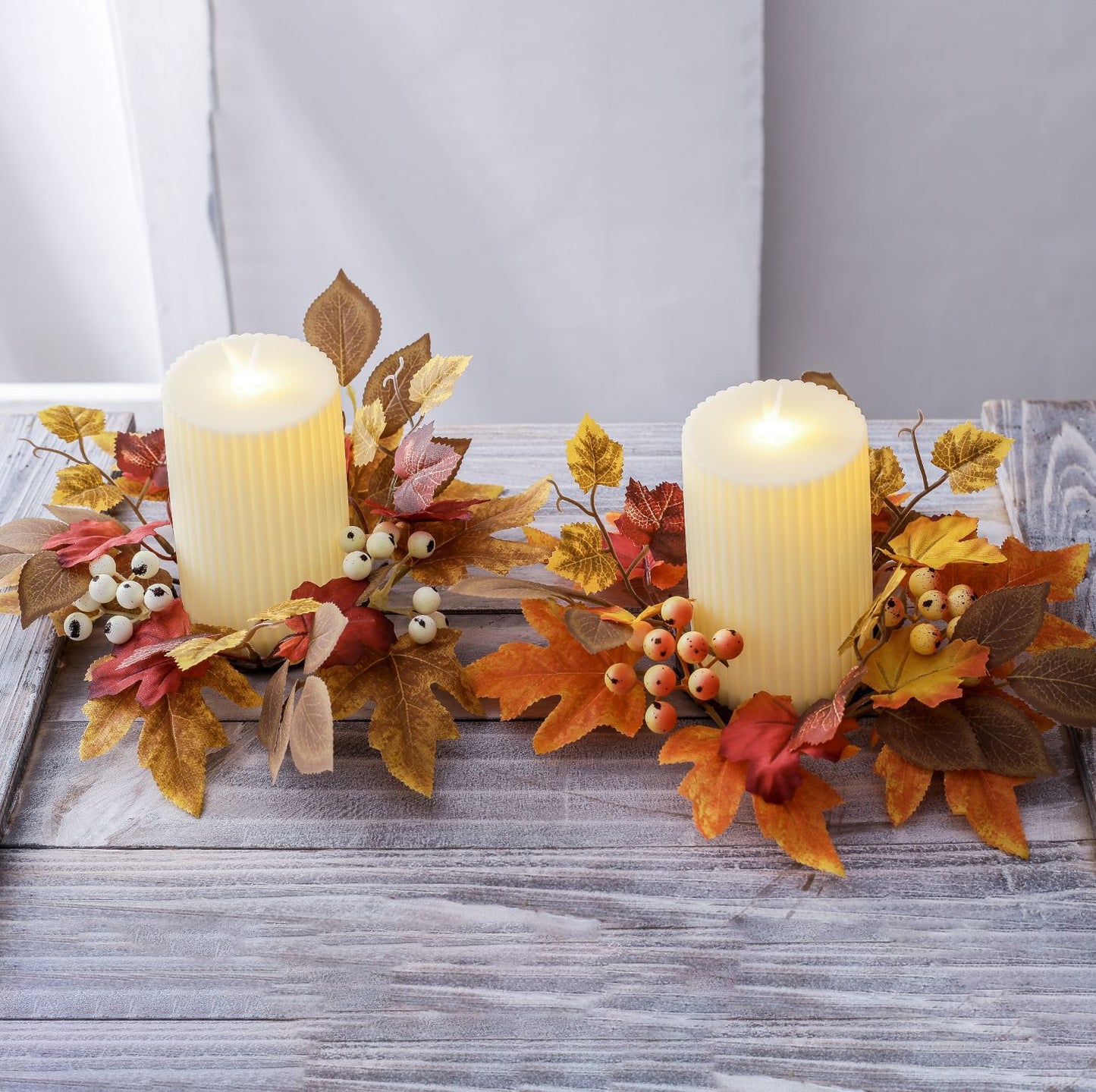 Autumn maple-leaf candle garland with fruit accents