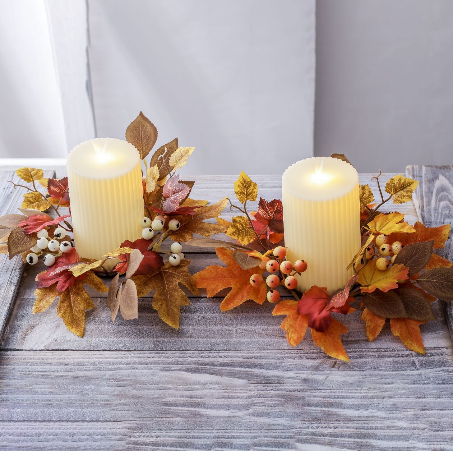 Autumn maple-leaf candle garland with fruit accents